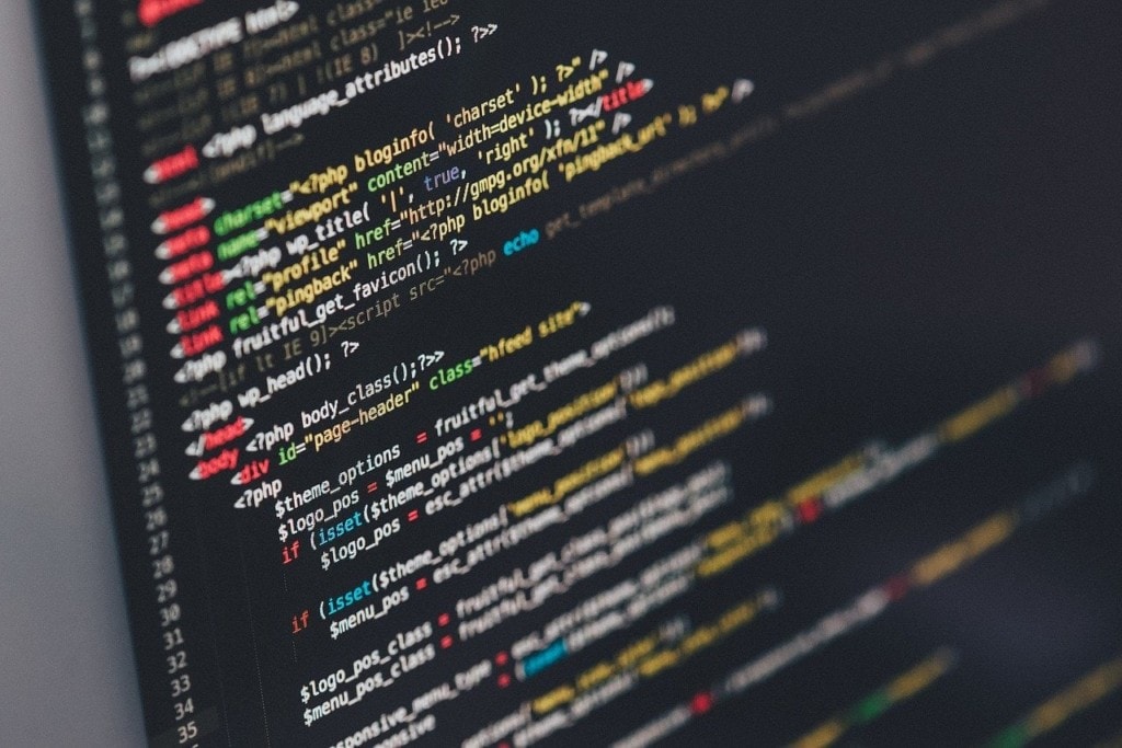 Computer screen displaying complex lines of code
